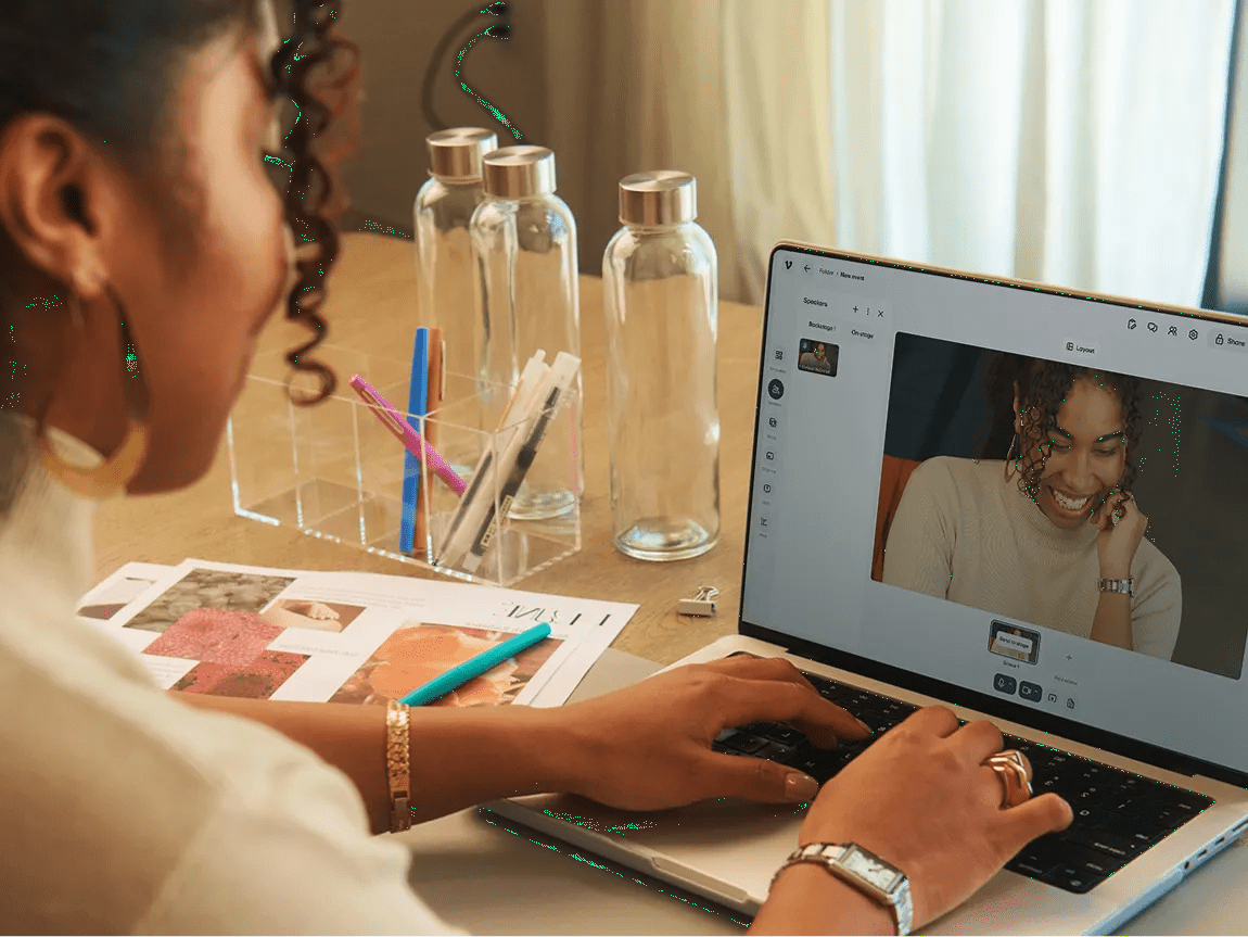 a woman on a laptop using live webinar tools from Vimeo