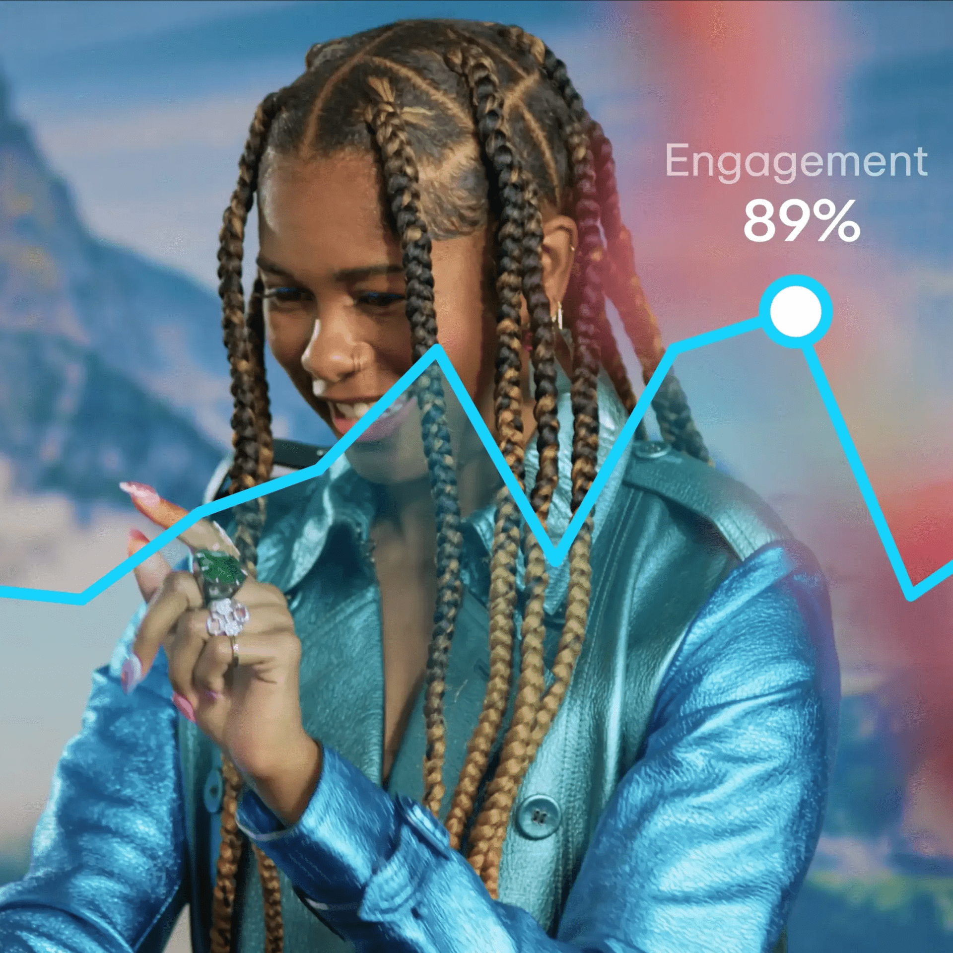 Woman in metallic jacket with colorful rings and nails looks at analytics.