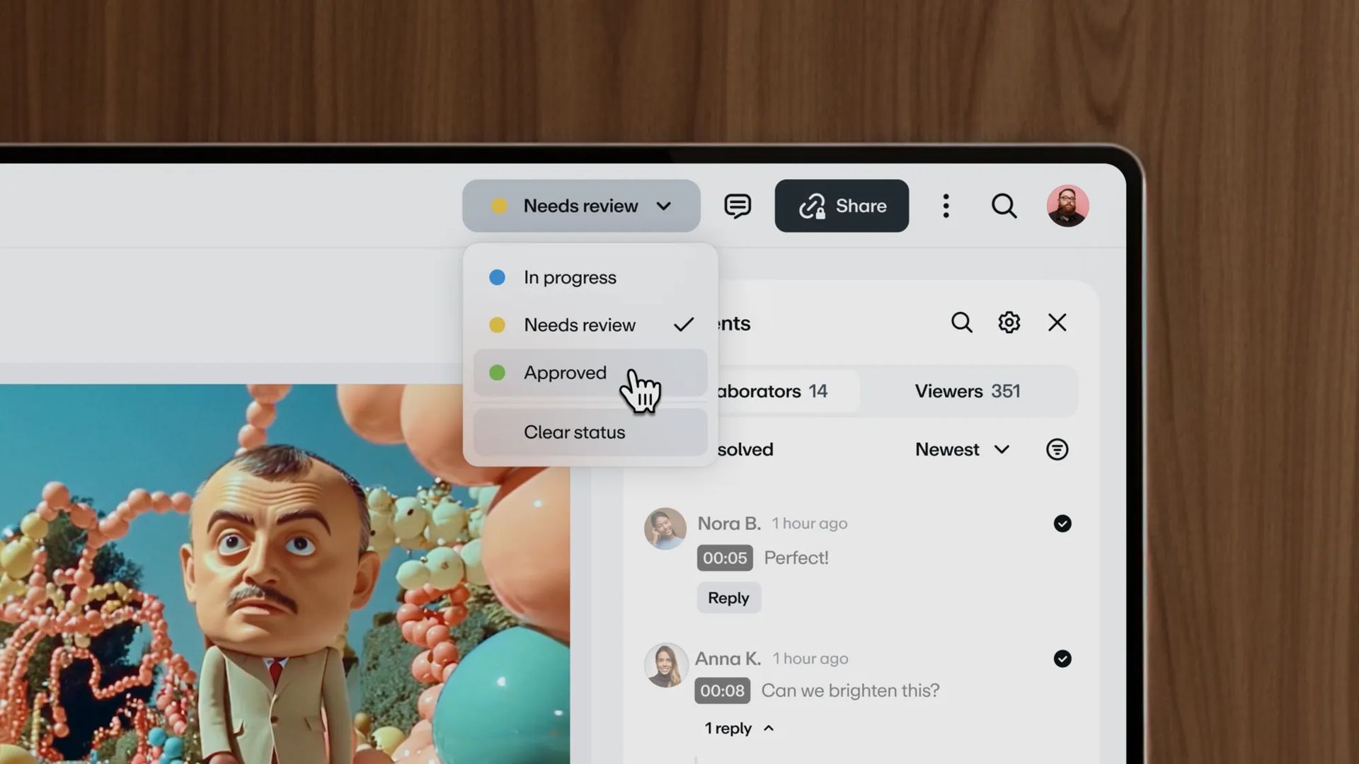 Corner of laptop screen showing Vimeo Review UI, marked approved